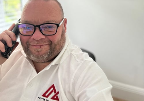 Ashton Lee Surveyors team discussing property reports